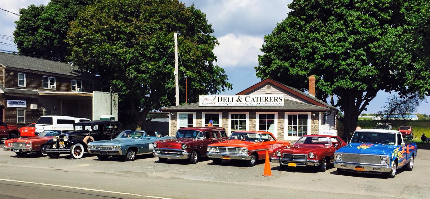 Classic cars outside the deli
